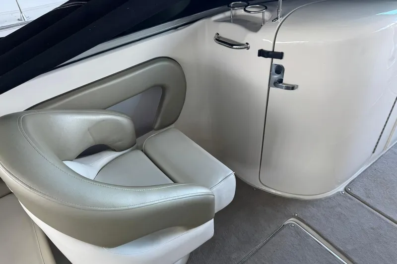 Slide: The Image of Interior of 2006 Sea Ray 240 Sundeck with beige seating and sleek design. - 6
