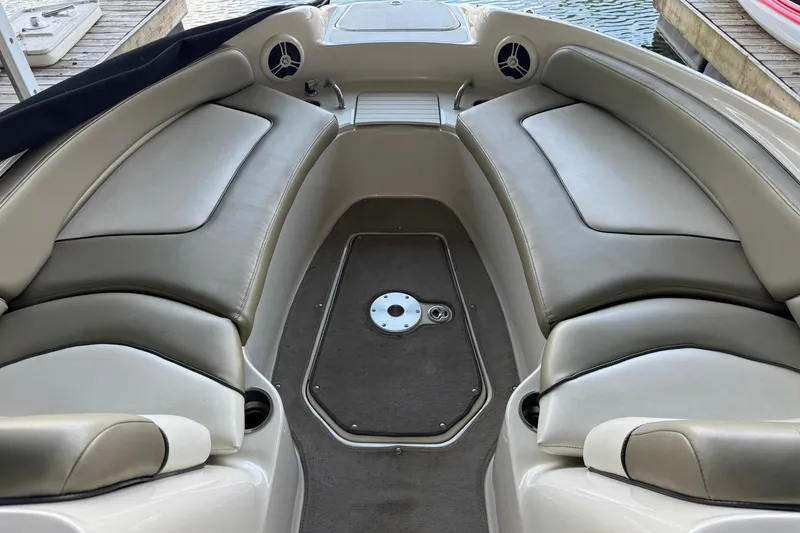 Slide: The Image of 2006 Sea Ray 240 Sundeck interior with spacious seating and sleek design. - 8
