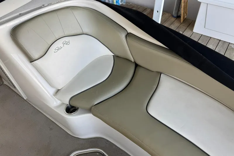 Slide: The Image of 2006 Sea Ray 240 Sundeck boat seat with beige and white upholstery. - 9
