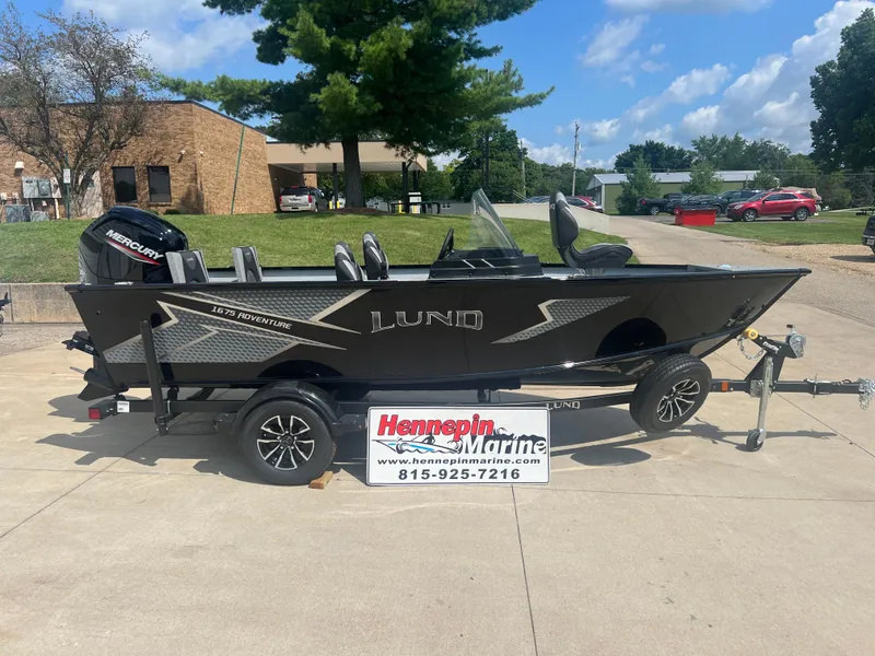 The Image of 2025 Lund 1675 Adventure SS boat on trailer at Hennepin Marine dealership. - 0