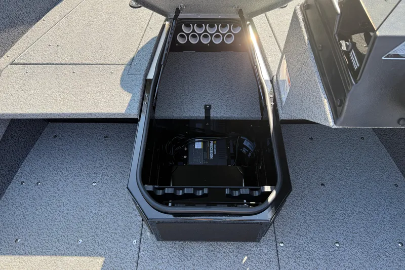 Slide: The Image of 2026 Lund 1675 Adventure SS boat storage compartment with battery charger and rod holders. - 14