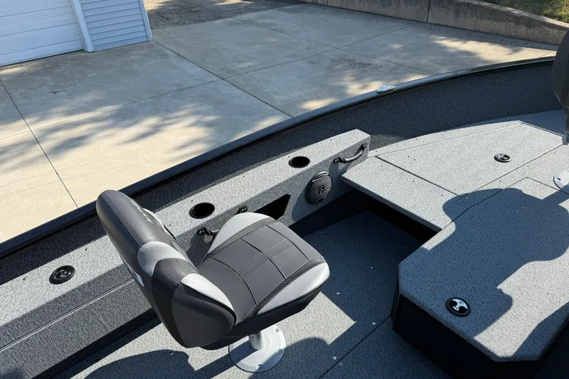 Slide: The Image of 2026 Lund 1675 Adventure SS boat interior with seating and storage compartments. - 21