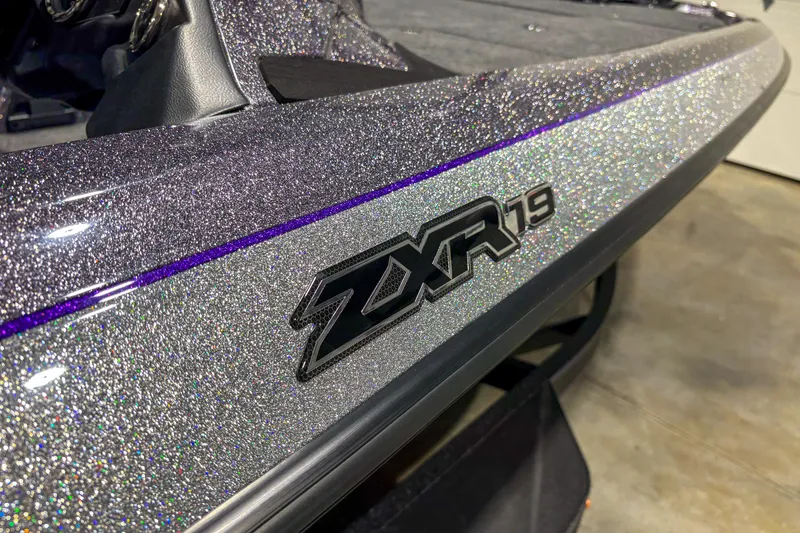 Slide: The Image of 2026 Skeeter ZXR 19 boat with glittery finish and sleek design. - 3