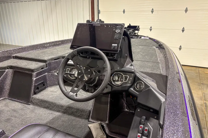 Slide: The Image of 2026 Skeeter ZXR 19 boat interior with steering wheel and control panel. - 6
