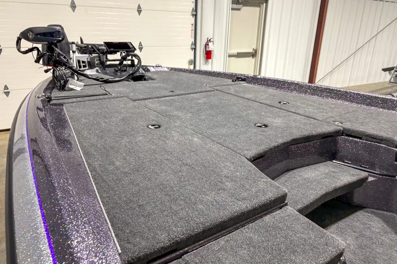 Slide: The Image of 2026 Skeeter ZXR 19 boat deck with carpeted surface and mounted equipment. - 9