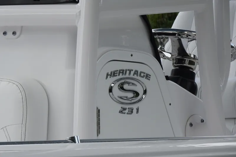 Slide: The Image of 2023 Sportsman Heritage 231 Center Console boat interior with logo detail. - 22