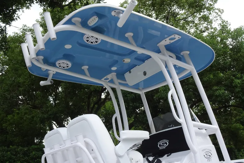 Slide: The Image of 2023 Sportsman Heritage 231 Center Console boat with T-top and rod holders. - 23