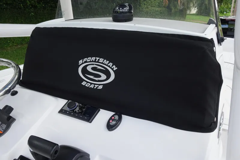 Slide: The Image of 2023 Sportsman Heritage 231 Center Console dashboard with protective cover and controls. - 24
