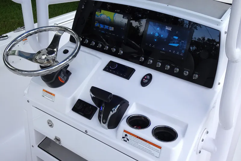 Slide: The Image of 2023 Sportsman Heritage 231 Center Console dashboard with steering wheel and digital displays. - 25