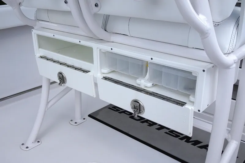 Slide: The Image of 2023 Sportsman Heritage 231 Center Console storage compartments with open drawers. - 26