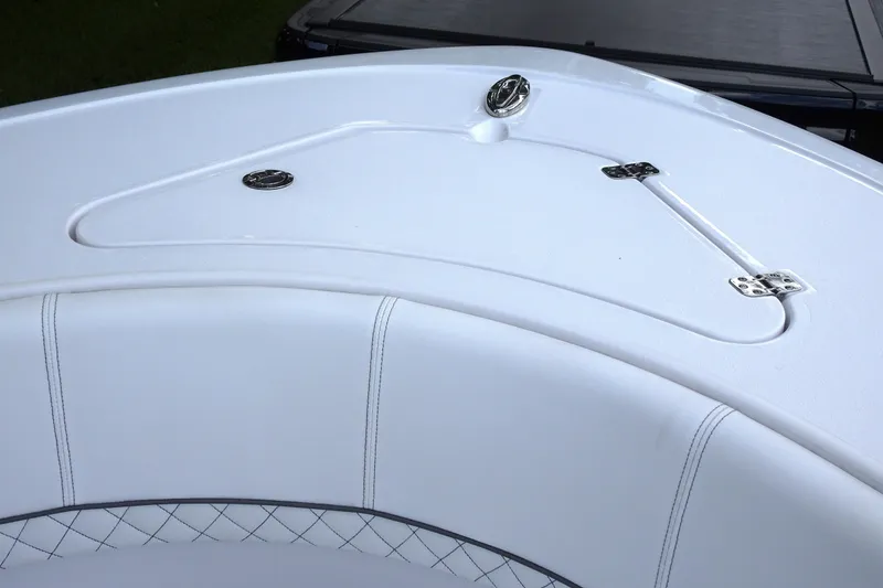 Slide: The Image of 2023 Sportsman Heritage 231 Center Console boat, white seating and storage compartment. - 5