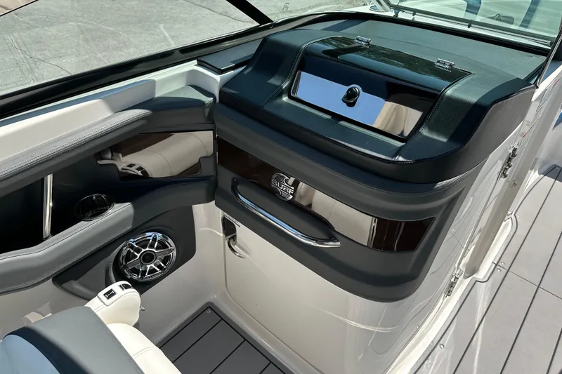 Slide: The Image of 2024 Chaparral 26 Surf boat interior with sleek dashboard and modern design. - 12