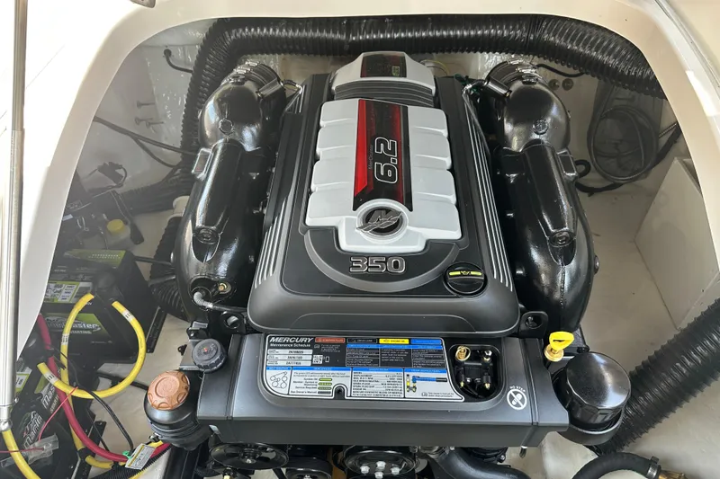 Slide: The Image of 2024 Chaparral 26 Surf boat engine compartment with Mercury 6.2L 350 HP engine. - 21