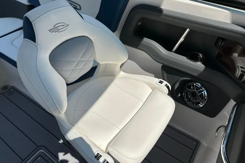 Slide: The Image of Luxury seating in 2024 Chaparral 26 Surf boat with premium upholstery and speaker system. - 7
