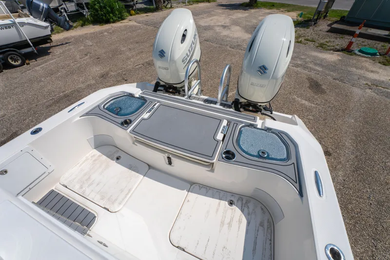 Slide: The Image of 2020 Sea Cat 26 Hybrid boat with dual Suzuki engines, spacious deck, and storage compartments. - 11