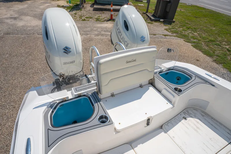 Slide: The Image of 2020 Sea Cat 26 Hybrid boat with dual Suzuki 200 engines, featuring a spacious deck layout. - 12
