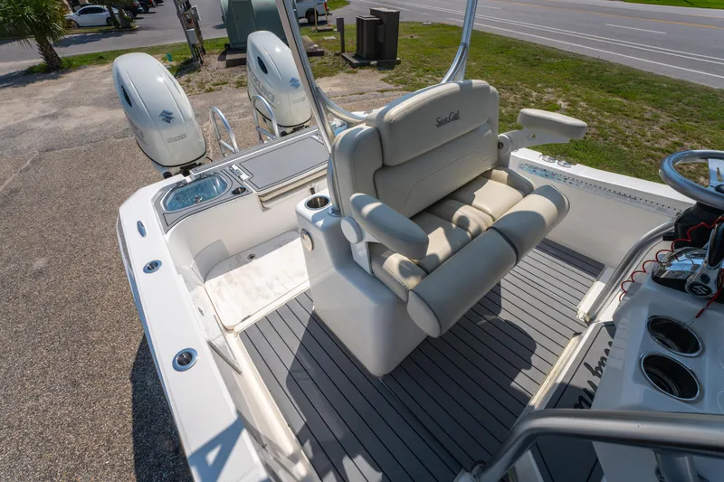 Slide: The Image of 2020 Sea Cat 26 Hybrid boat interior with dual engines and comfortable seating. - 17