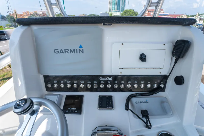 Slide: The Image of Control panel of a 2020 Sea Cat 26 Hybrid boat featuring Garmin electronics. - 20