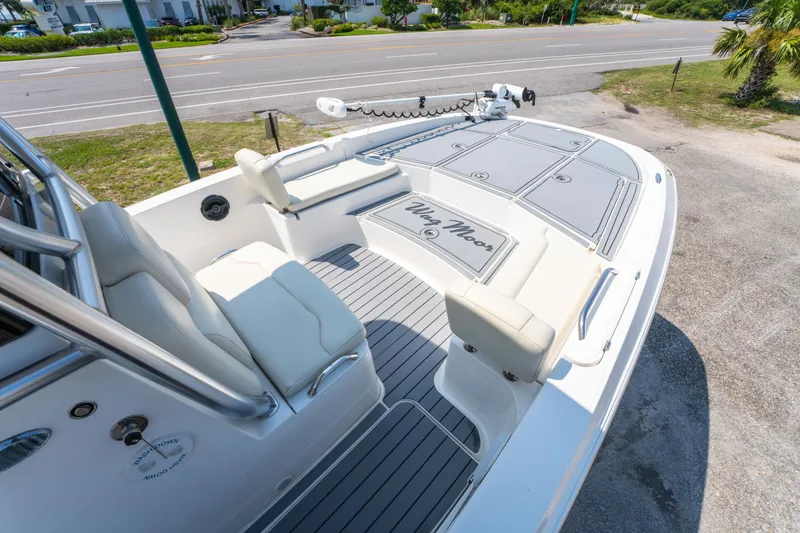 Slide: The Image of 2020 Sea Cat 26 Hybrid boat with cushioned seating and sleek deck design. - 24