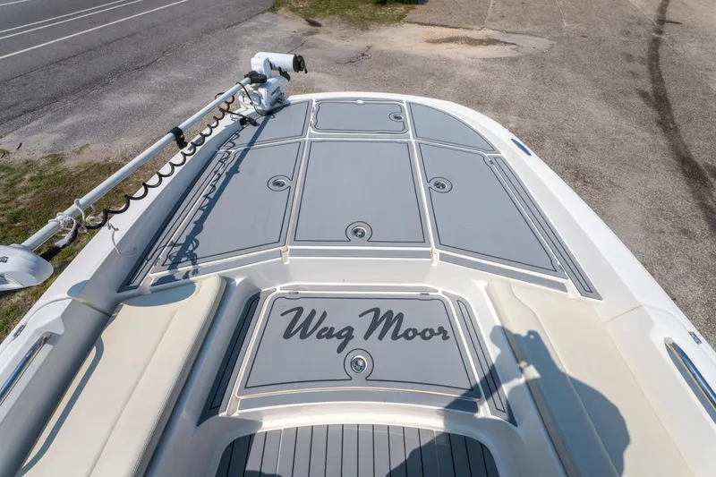 Slide: The Image of 2020 Sea Cat 26 Hybrid boat deck with "Wag Moor" text, featuring storage compartments. - 25