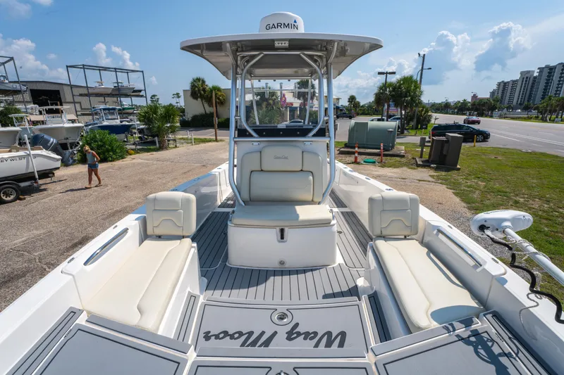Slide: The Image of 2020 Sea Cat 26 Hybrid boat with spacious seating and Garmin equipment, docked outdoors. - 27