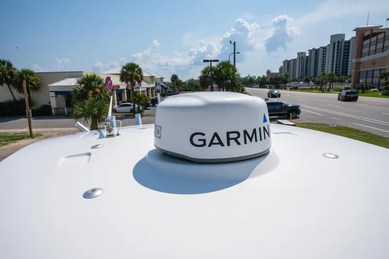 Slide: The Image of Garmin radar on 2020 Sea Cat 26 hybrid boat, parked near a busy street. - 28