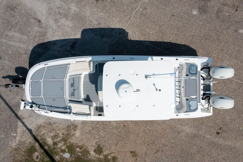 Slide: The Image of Aerial view of 2020 Sea Cat 26 Hybrid boat on a trailer, parked on gravel. - 31