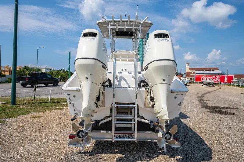 Slide: The Image of 2020 Sea Cat 26 Hybrid boat with dual outboard engines on a trailer. - 4