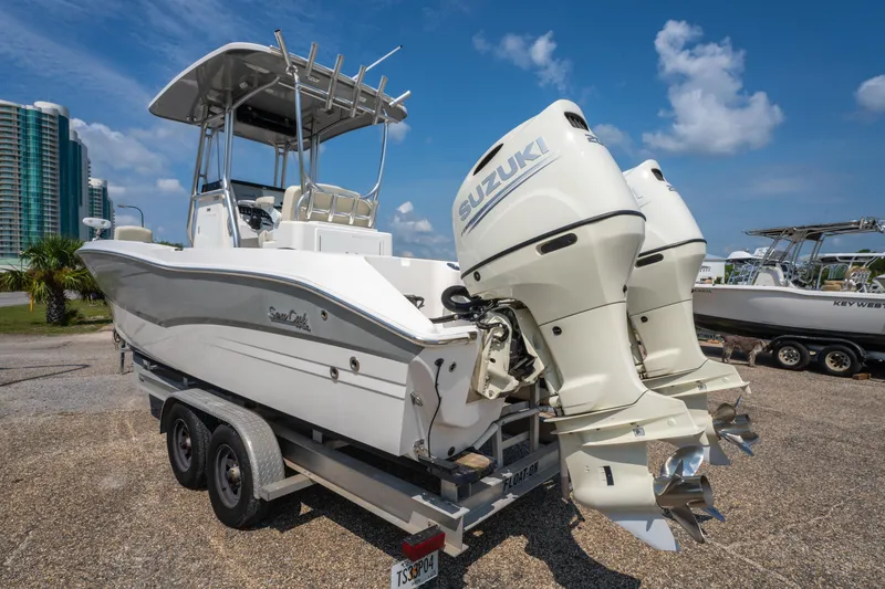 Slide: The Image of 2020 Sea Cat 26 Hybrid boat with dual Suzuki engines on a trailer. - 5