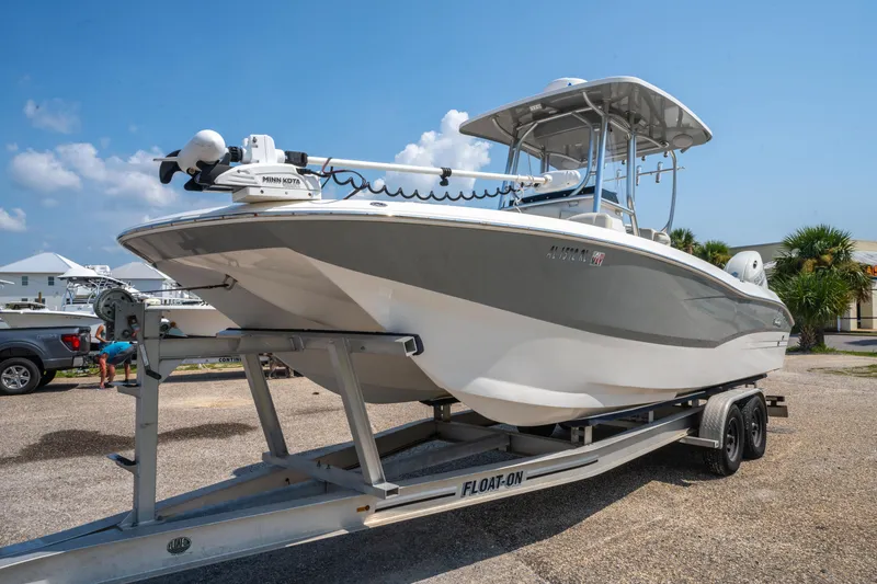 Slide: The Image of 2020 Sea Cat 26 Hybrid boat on trailer, parked outdoors under clear sky. - 8