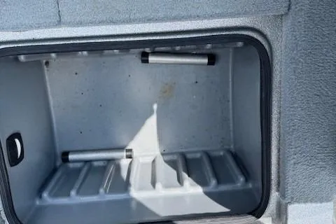 Slide: The Image of Storage compartment of a 2005 Triton Tr-186 DC boat, featuring a spacious interior. - 15