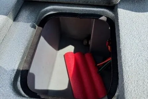 Slide: The Image of Storage compartment in 2005 Triton Tr-186 DC boat with red foam padding. - 18