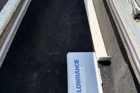 Slide: The Image of 2005 Triton Tr-186 DC boat compartment with Lowrance equipment. - 19