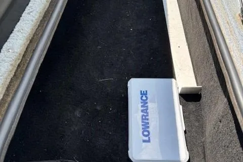 Slide: The Image of 2005 Triton Tr-186 DC boat compartment with Lowrance equipment. - 21