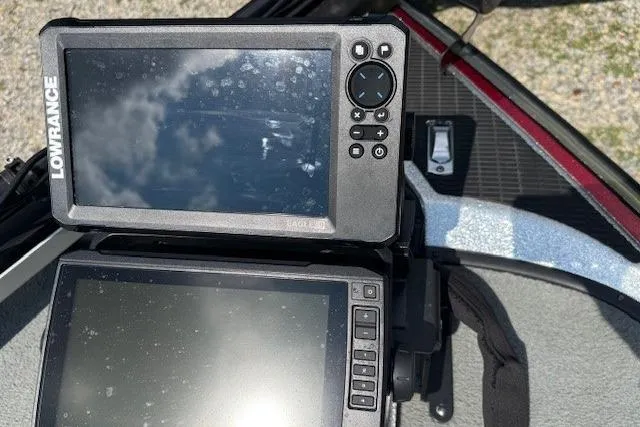 Slide: The Image of Lowrance fish finders on a 2005 Triton Tr-186 DC boat dashboard. - 4