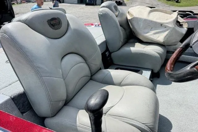 Slide: The Image of 2005 Triton Tr-186 DC boat interior with plush seating and steering wheel. - 8