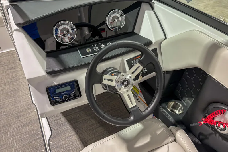 Slide: The Image of 2026 Four Winns H2 boat dashboard with steering wheel and control panel. - 10