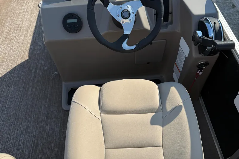 Slide: The Image of 2021 Sun Tracker Party Barge 22 DLX helm with steering wheel and control panel. - 13