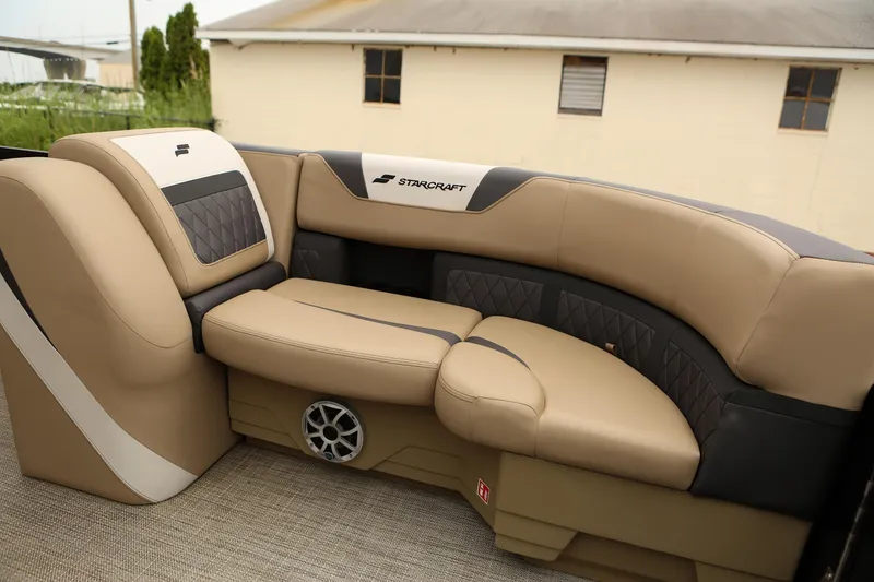 Slide: The Image of Luxurious seating in 2026 Starcraft SLS 3 boat, featuring tan and black upholstery. - 12