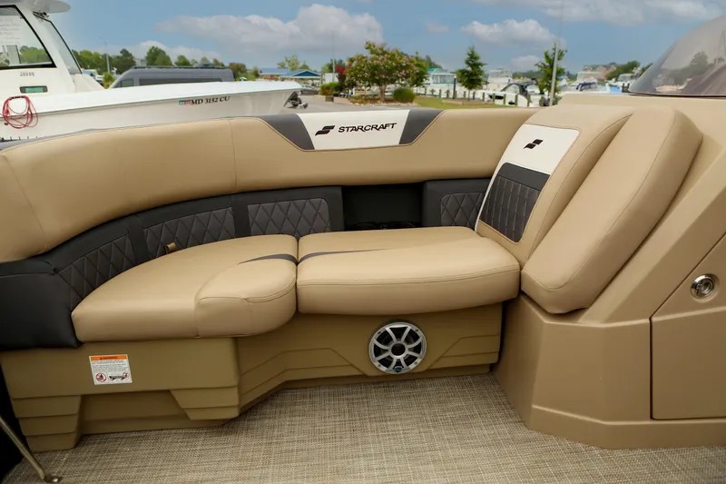 Slide: The Image of Luxurious seating on 2026 Starcraft SLS 3 boat, featuring beige and black upholstery. - 14