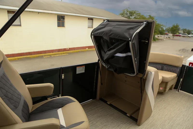 Slide: The Image of Interior of 2026 Starcraft SLS 3 boat with beige seating and storage compartment. - 18