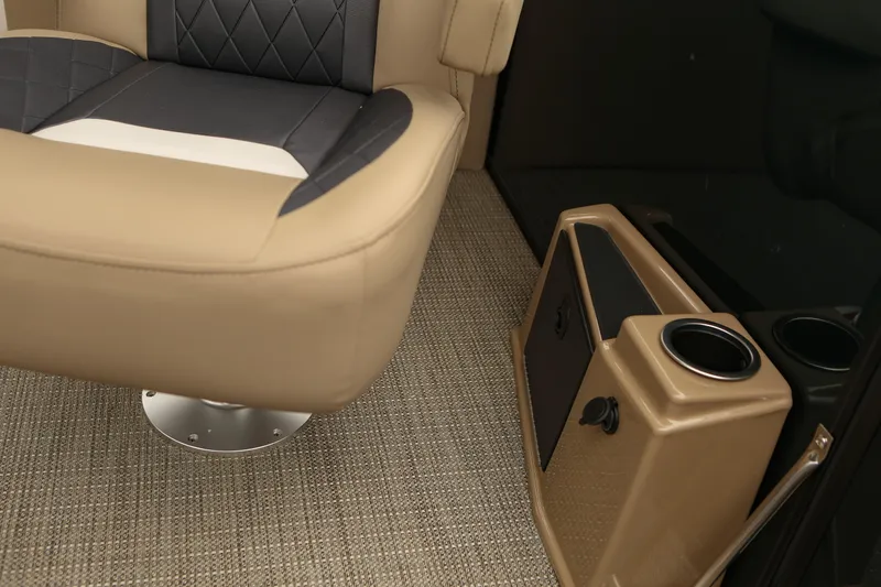 Slide: The Image of 2026 Starcraft SLS 3 interior with beige and black seating, cup holder, and carpeted flooring. - 19