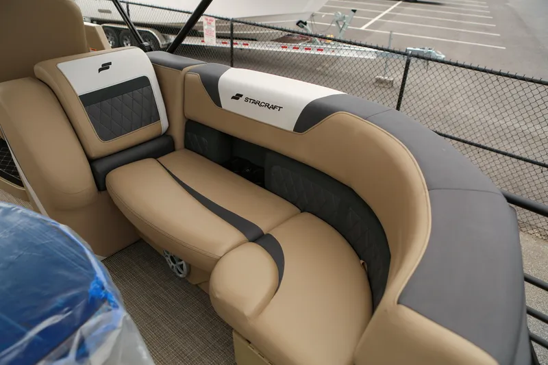 Slide: The Image of Luxurious seating in 2026 Starcraft SLS 3 boat, featuring beige and black upholstery. - 24