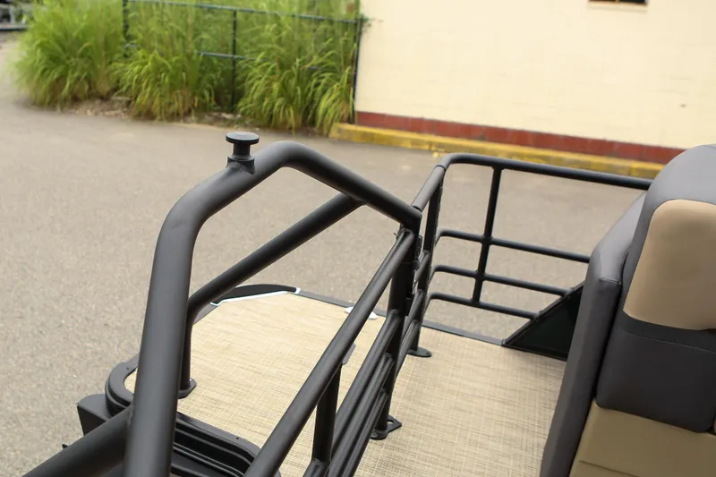 Slide: The Image of 2026 Starcraft SLS 3 boat railing and seating detail, outdoor setting. - 28