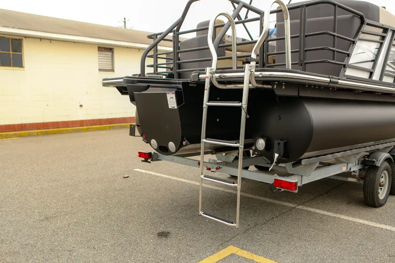 Slide: The Image of 2026 Starcraft SLS 3 pontoon boat on trailer, rear view with ladder. - 29