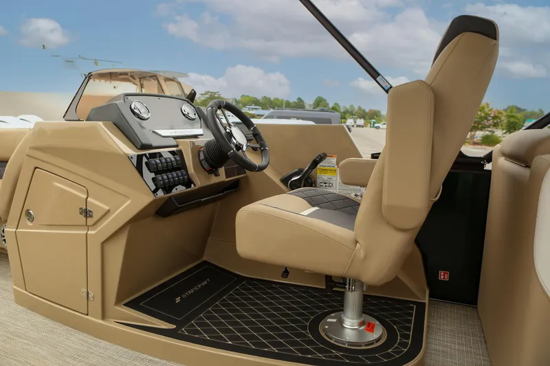 Slide: The Image of 2026 Starcraft SLS 3 boat interior with beige captain's seat and modern dashboard. - 3