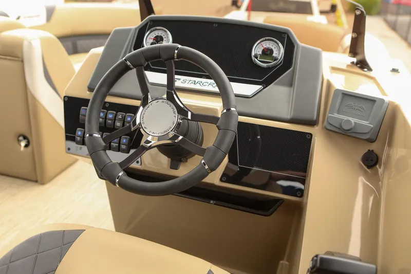 Slide: The Image of 2026 Starcraft SLS 3 boat dashboard with steering wheel and control panel. - 4