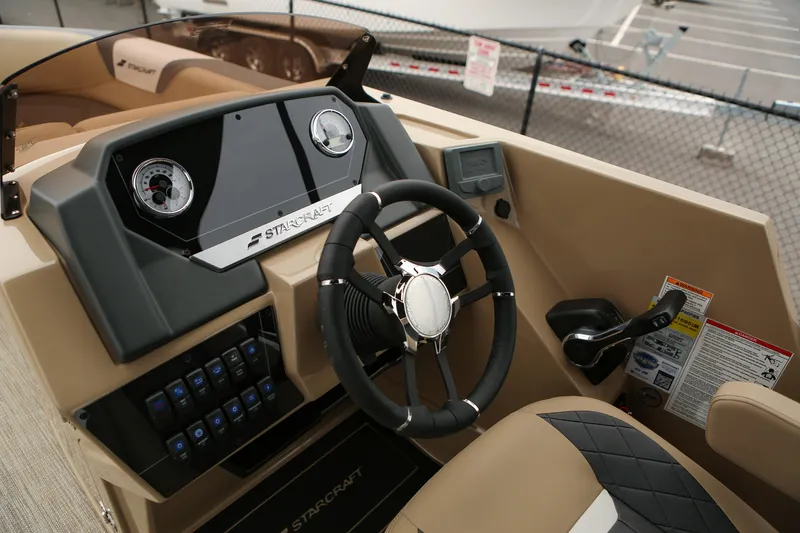 Slide: The Image of 2026 Starcraft SLS 3 boat dashboard with steering wheel and control panel. - 6