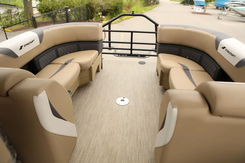 Slide: The Image of Luxurious interior of 2026 Starcraft SLS 3 pontoon boat with beige seating. - 9