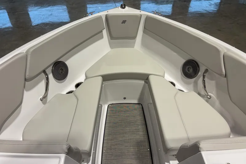 Slide: The Image of 2026 Four Winns H1 boat interior with cushioned seating and built-in speakers. - 12